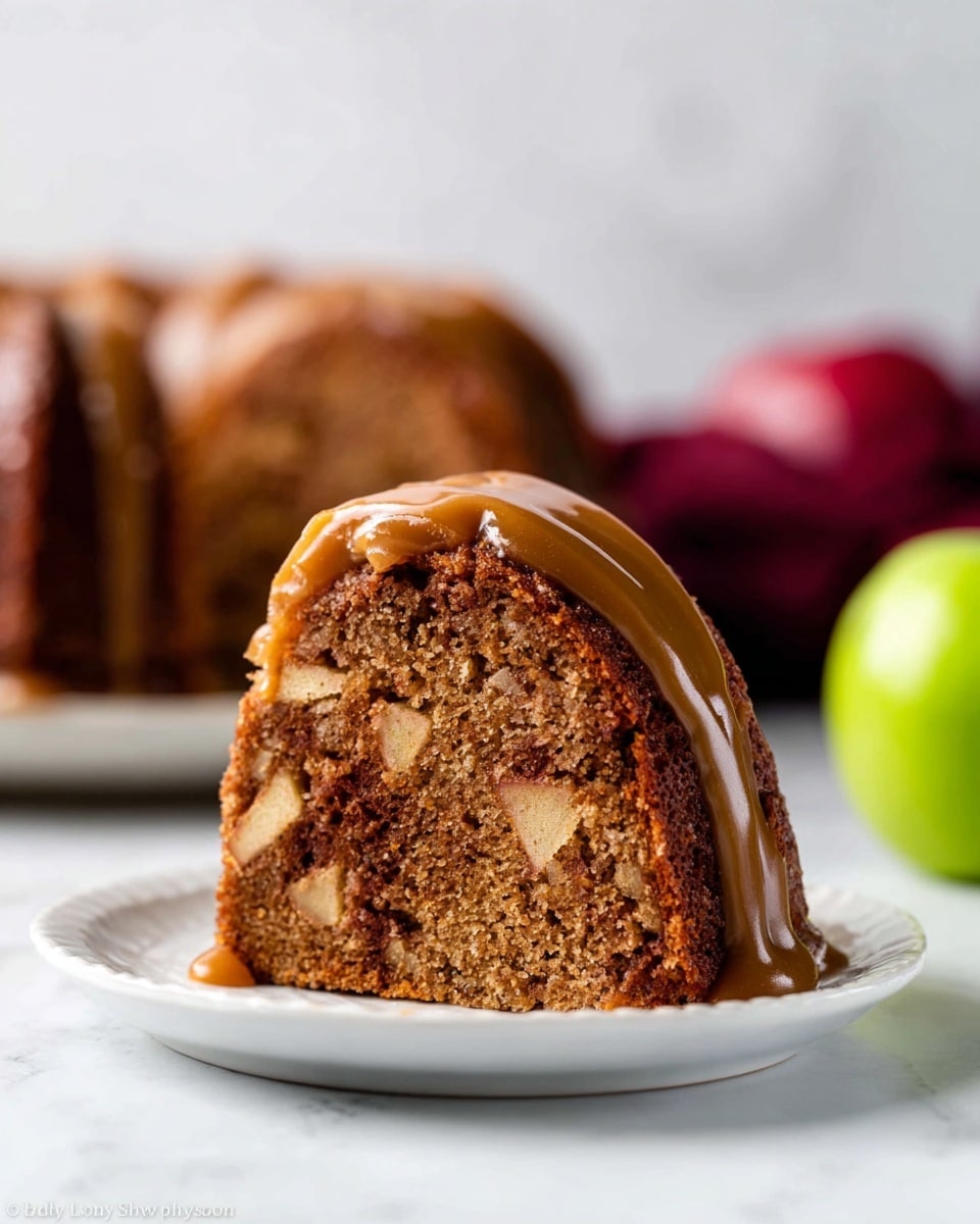 A close-up view of a dark brown bundt cake with a dense texture, covered by a smooth, light tan glaze that drips down the sides in thick ribbons. The cake sits on a rustic wooden board with bark edges, placed on a white marbled surface. The glaze is evenly spread, creating a glossy contrast against the rich cake, highlighting its curved shape and deep grooves in the bundt. photo taken with an iphone --ar 4:5 --v 7